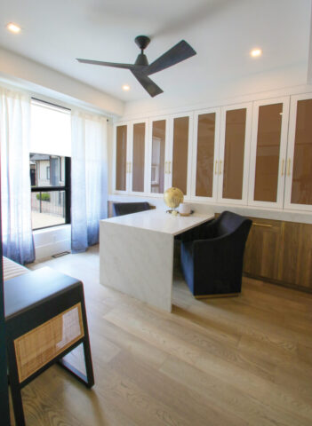 Custom cabinetry and a minimalist design create a sophisticated workspace for everyday productivity.